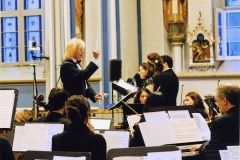Douglas Knight conducting orchestra